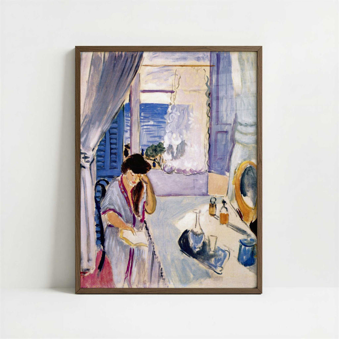 Woman Reading at a Dressing Table (1919) by Henri Matisse – Art Print - Art print in dark wood frame