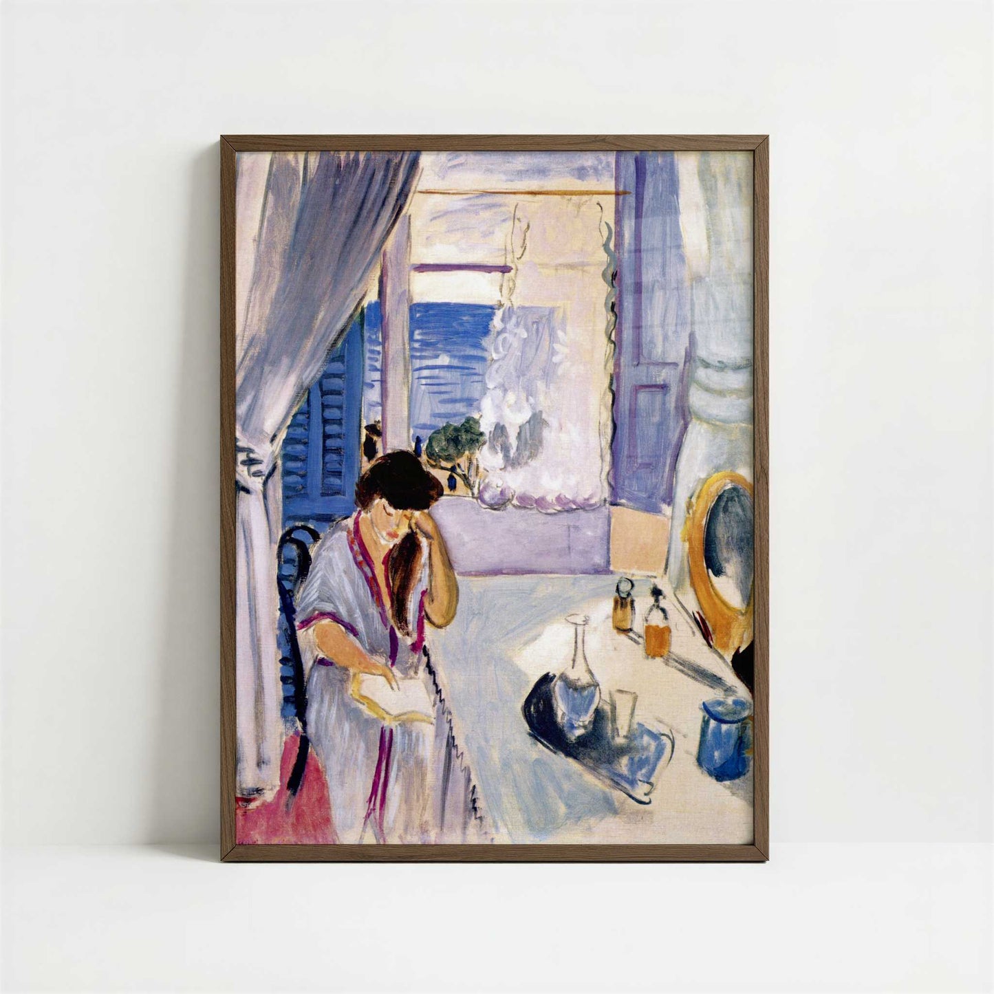 Woman Reading at a Dressing Table (1919) by Henri Matisse – Art Print - Art print in dark wood frame