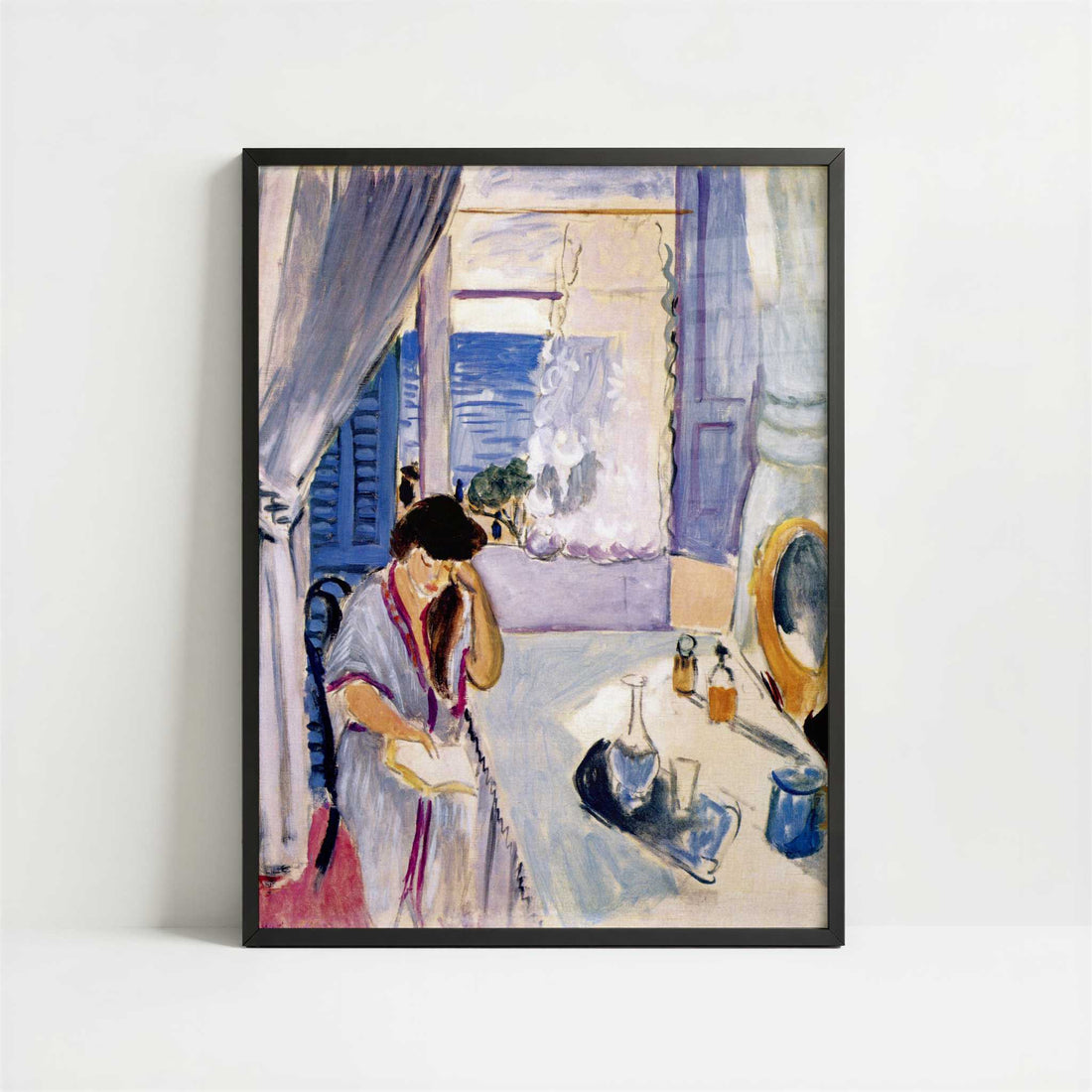 Woman Reading at a Dressing Table (1919) by Henri Matisse – Art Print - Art print in black frame