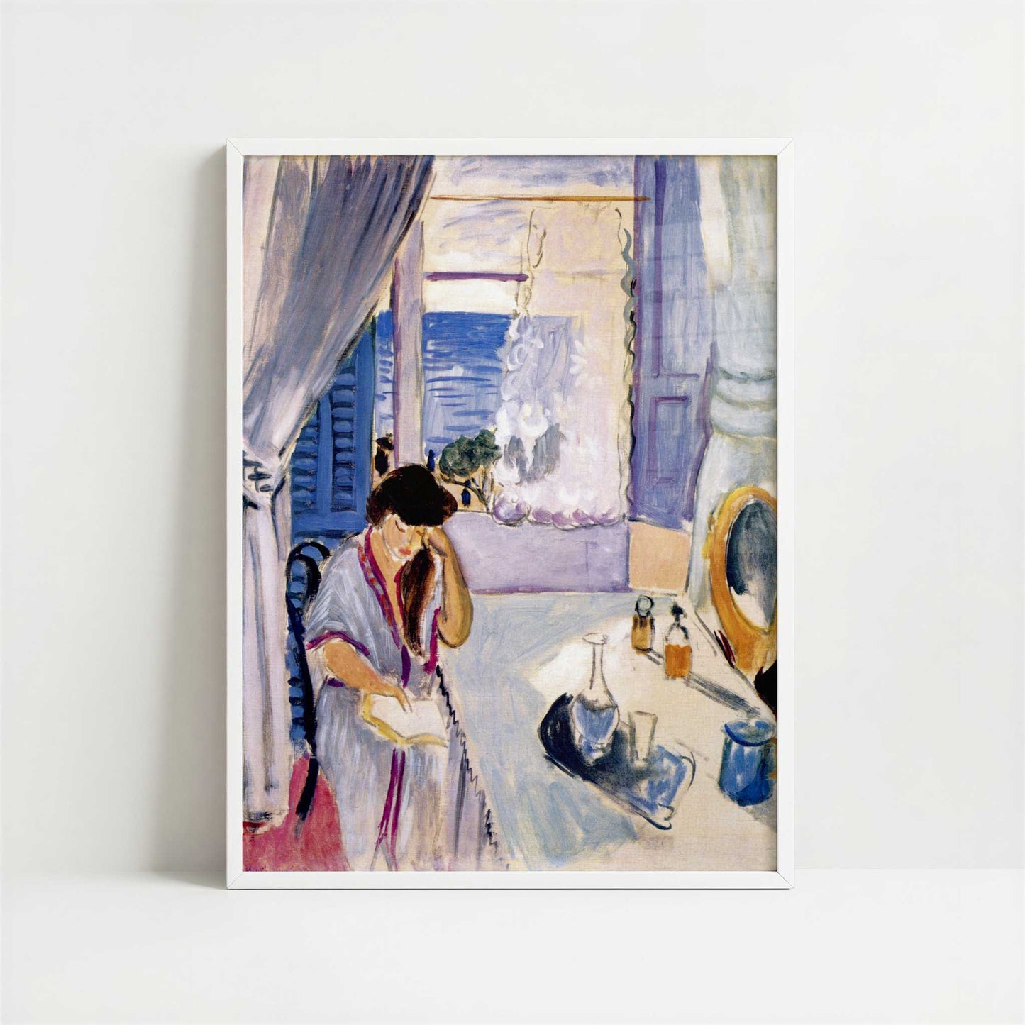 Woman Reading at a Dressing Table (1919) by Henri Matisse – Art Print - Art print in white frame