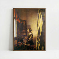 A Girl Reading a Letter (1657) by Johannes Vermeer – Art Print - Art print in dark wood frame