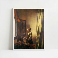 A Girl Reading a Letter (1657) by Johannes Vermeer – Art Print - Art print in white frame