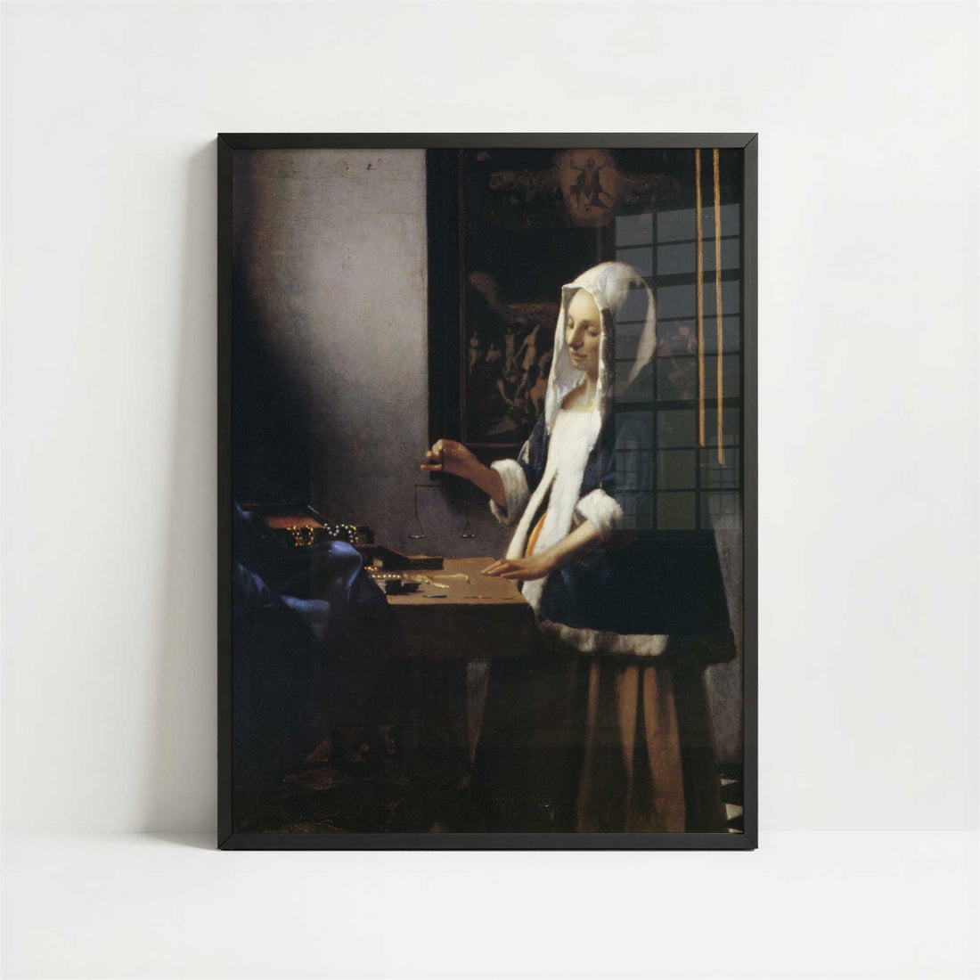 Woman Holding a Balance (1664) by Johannes Vermeer – Art Print - Art print in black frame